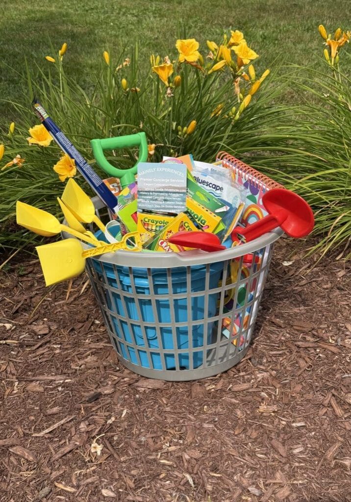 A basket filled with colorful gardening tools and seed packets outdoors.
